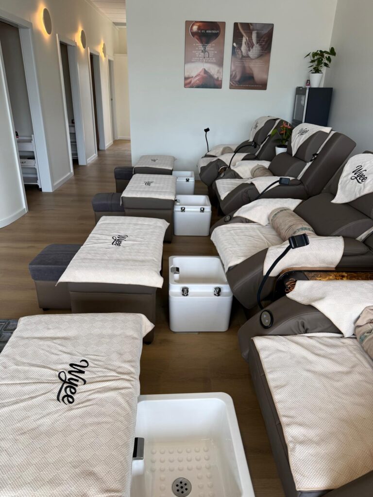 Foot spa lounge with recliners and basins at The Royal Orchid, Wyee